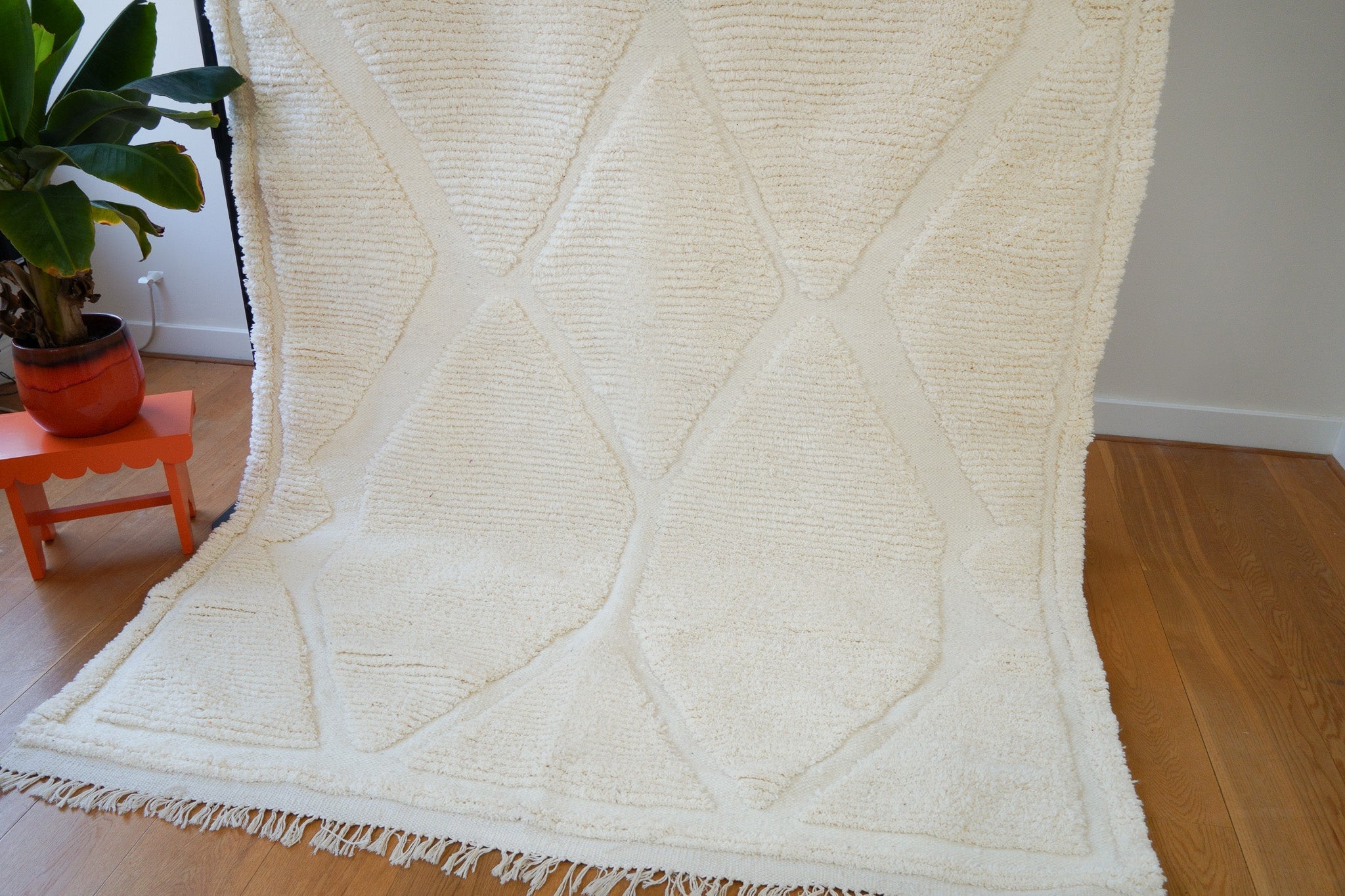 Close-up of ivory wool rug diamond weave