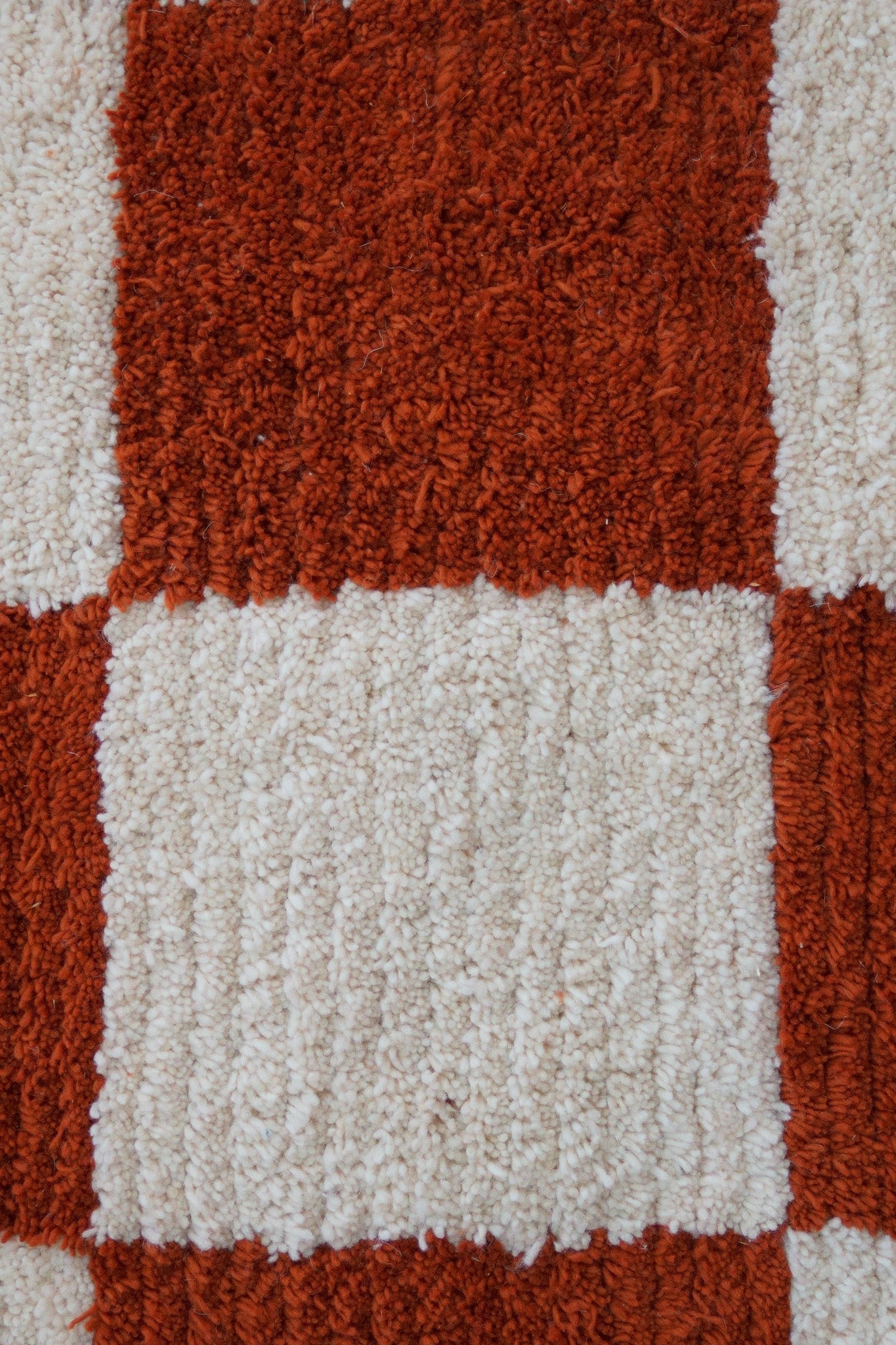 Close-up view of one square of the Fatma rug, showing plush wool texture and handwoven detail