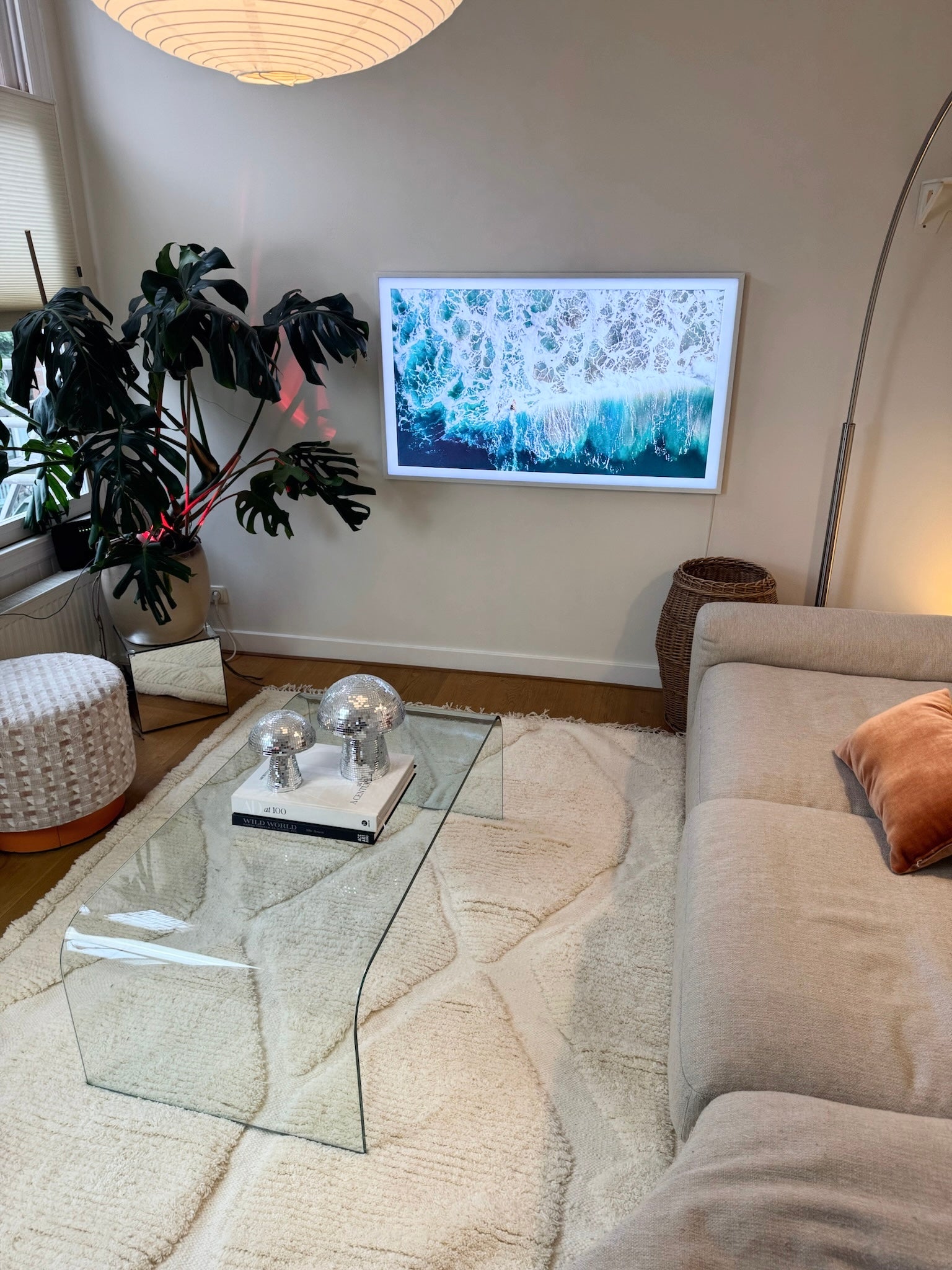 Ivory wool rug with diamond pattern styled in modern living room.