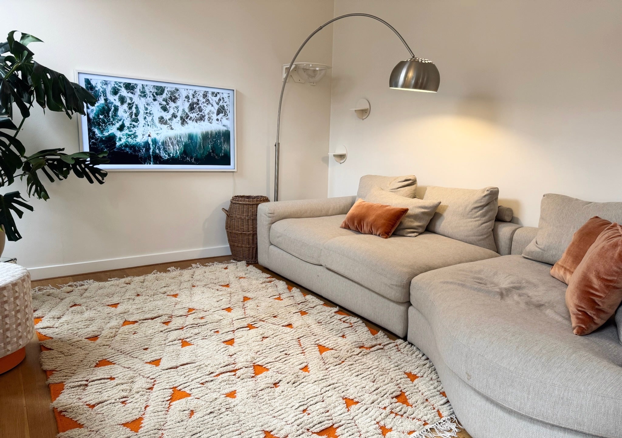 Orange & cream diamond wool rug styled in a modern living room