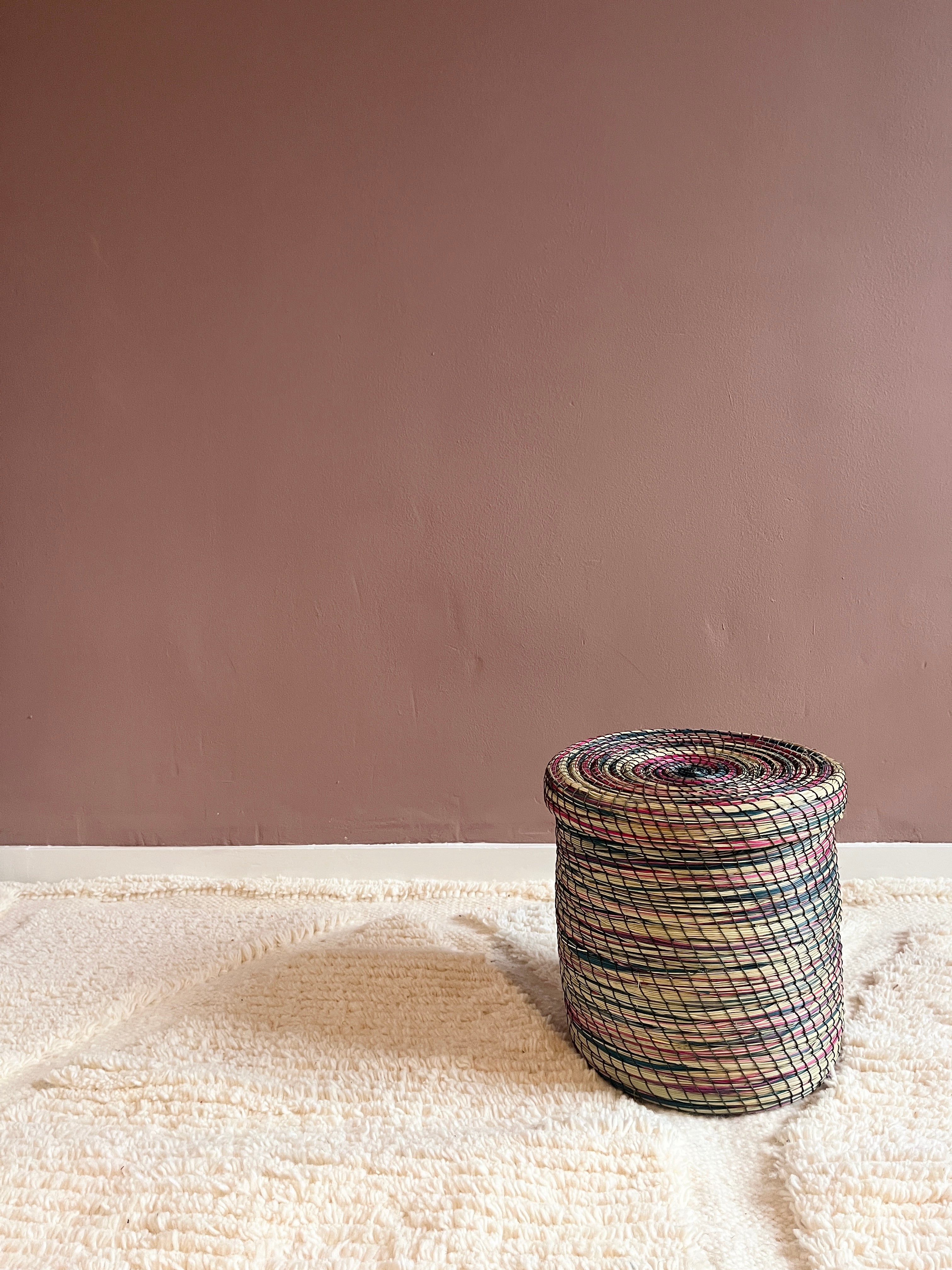 Detailed view of ivory wool rug with subtle diamond pattern.