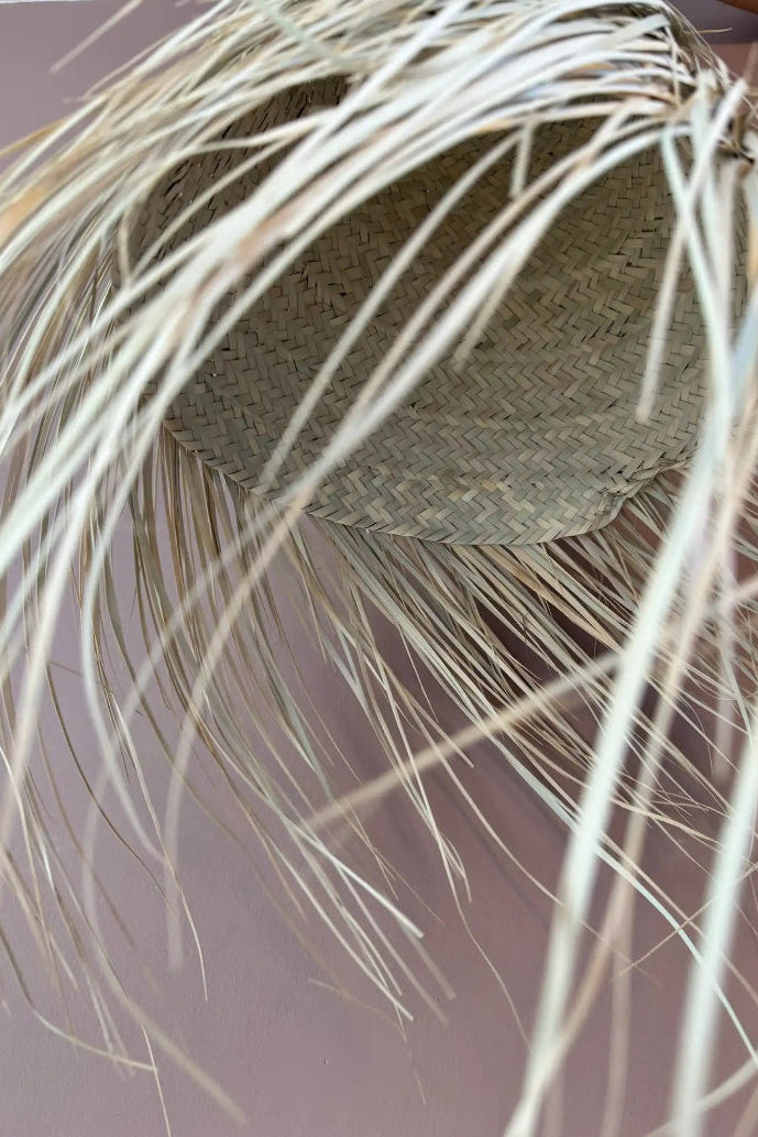 Detail of long palm fibre fringe on the Noor artisanal lampshade.
