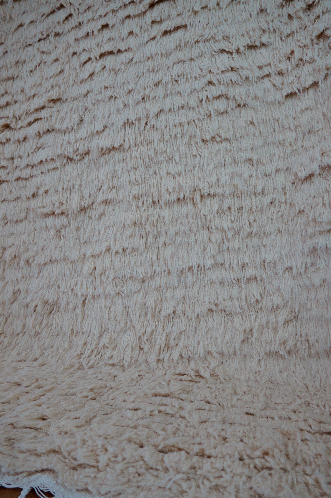 Detail of soft wool pile of the Samira rug, handmade in Tunisia