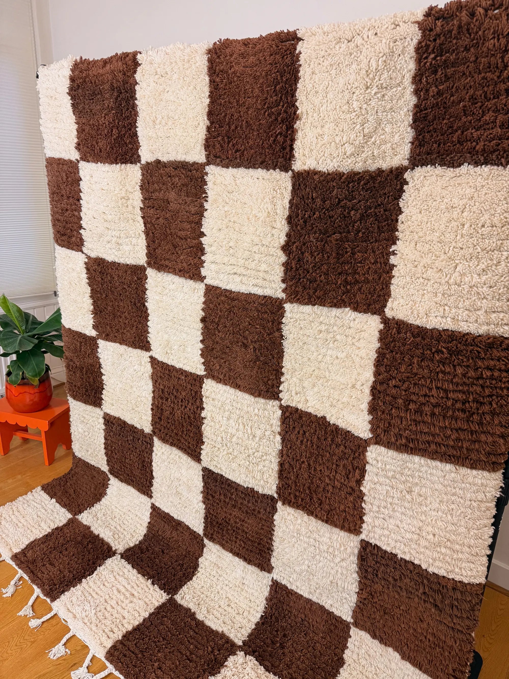 Meriem handmade Berber wool rug, full side view highlighting the depth of the wool pile and brown and white checkerboard pattern, handmade in Tunisia.